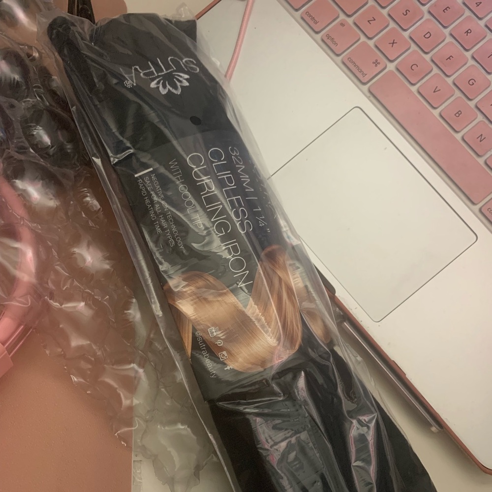 Sutra clip less curling iron